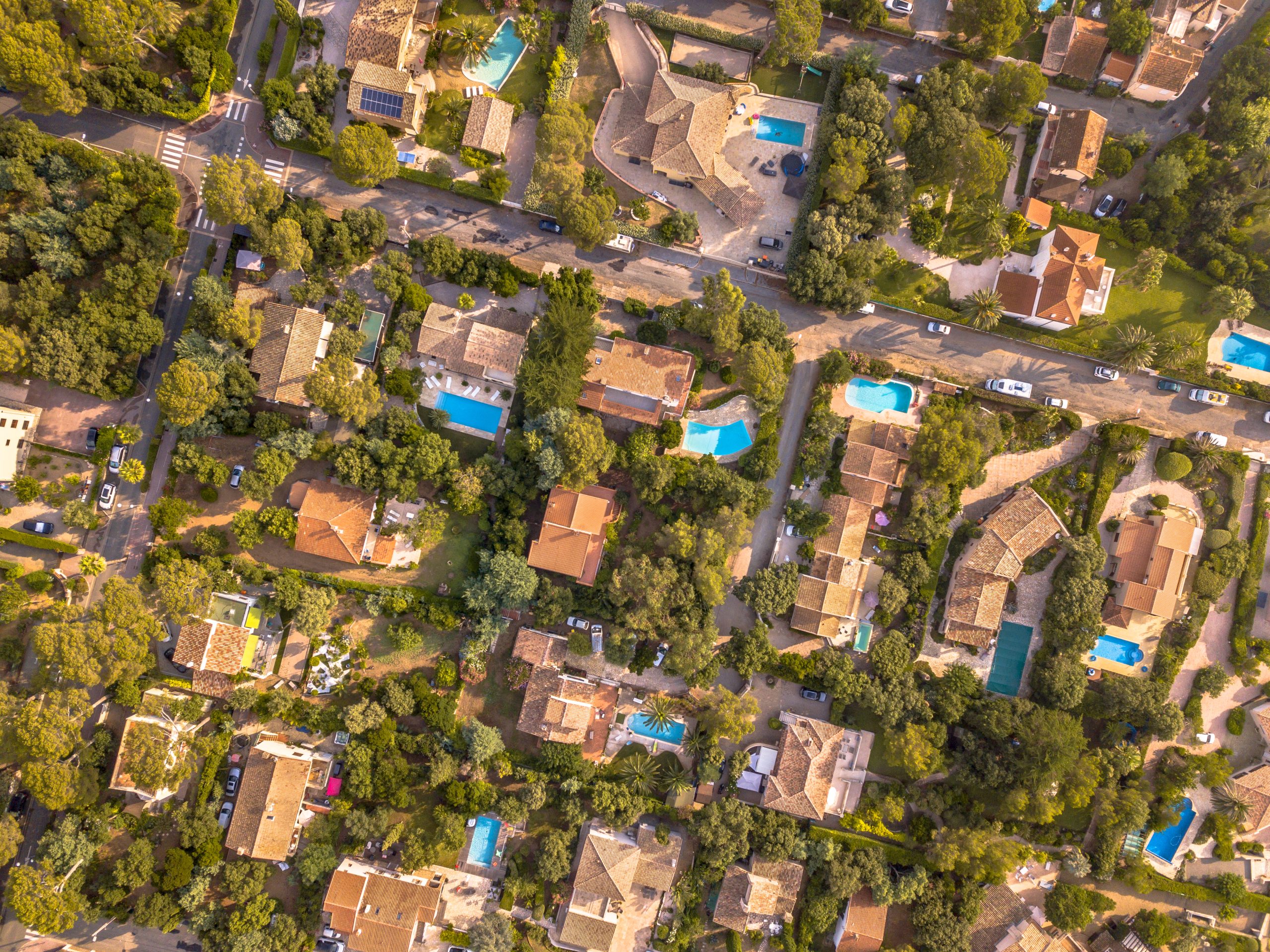 Overhead view of residential community, the heart of the real estate data revolution. Maurcole Unlimited